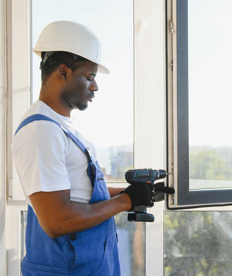 The KILT team installing and sealing windows and doors on site